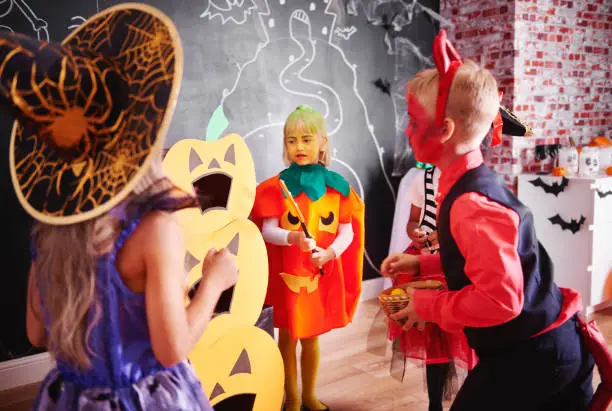 Photo of Children celebrating halloween at home