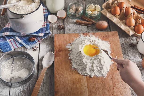 istock Woman baker makes dough with eggs, butter and flour 849163370