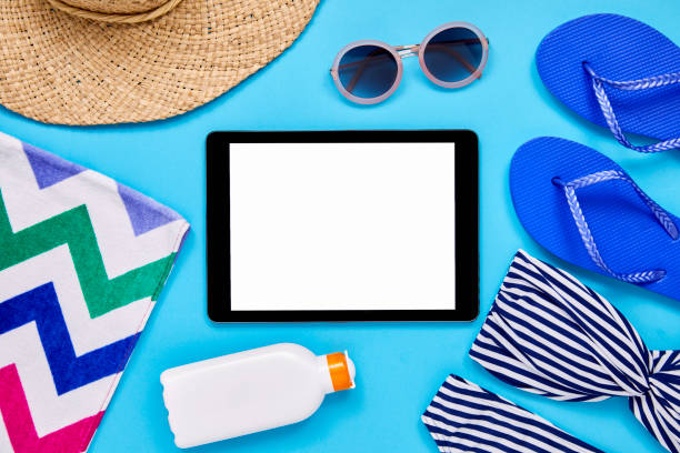 istock Overhead shot of tablet computer with summer vacation accessories 849163542