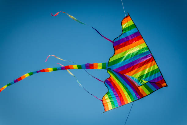 istock Colorful kite flying over clear blue sky 849166808