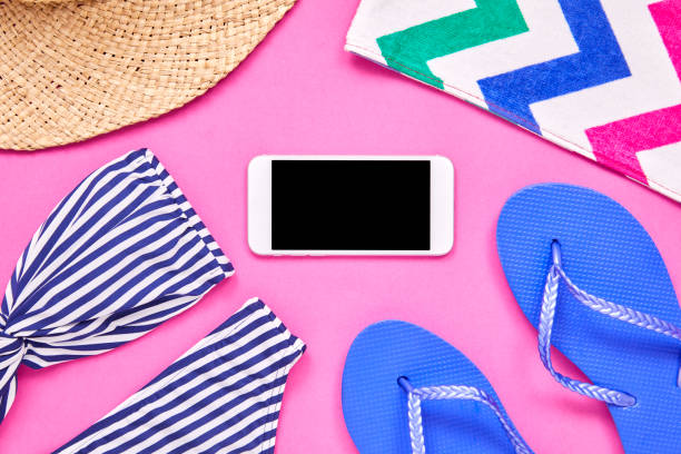 istock Flat lay of smart phone surrounded with beach accessories 849167026