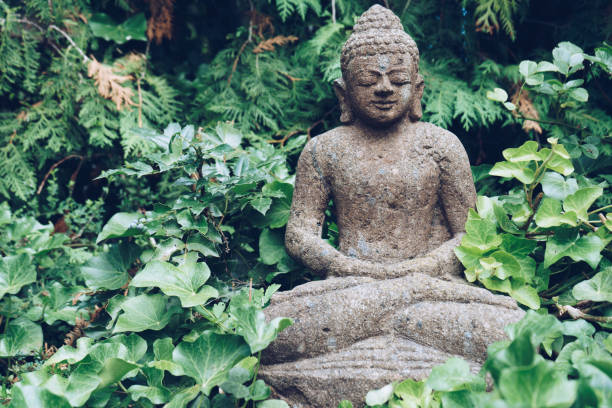 istock Buddha sculpture on green nature 849167162