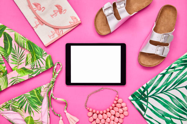 istock Overhead shot of tablet computer surrounded with summer vacation accessories 849167352