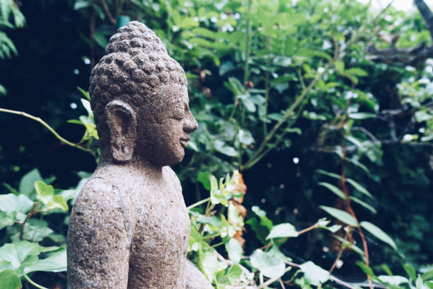 istock Buddha sculpture on green nature 849173836