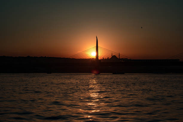istock Sunset in Istanbul with sun going behind the bridge 849176046