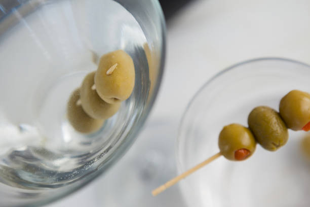 Martini glass on gold background, focus on rim of glass.