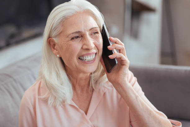 istock Joyful senior woman talking on smart phone 849177008