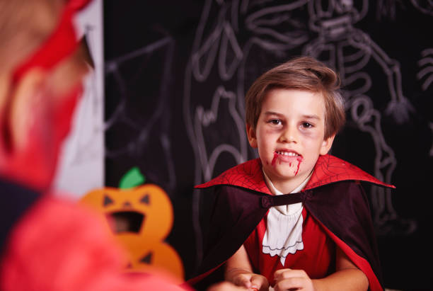 Portrait of boy dressed up as halloween vampire