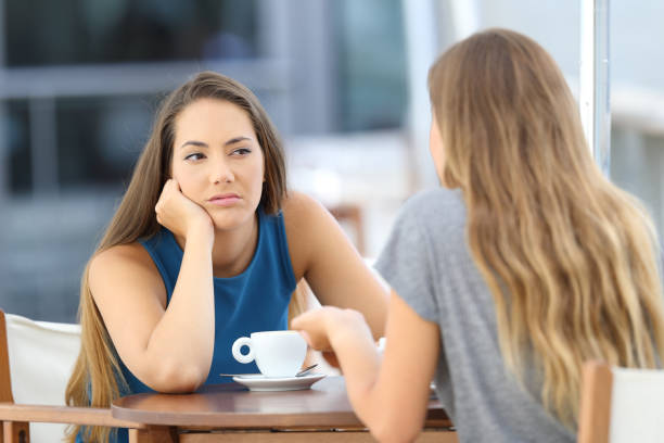 istock Bored girl listening a bad conversation 849177832