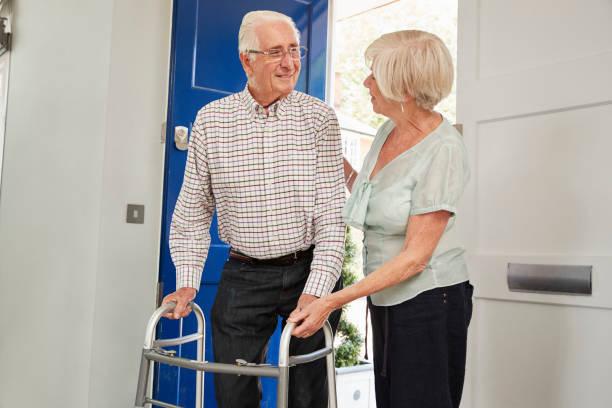 istock Senior couple at home talking, man using a walking frame 849178416