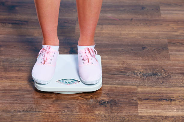 istock Woman feet on scales. 849178446