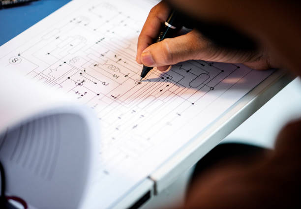 istock Closeup of hand over circuit pattern guide line paper 849178470