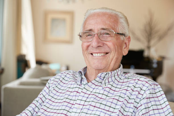 istock Happy senior man smiling to camera at home, close up 849180580