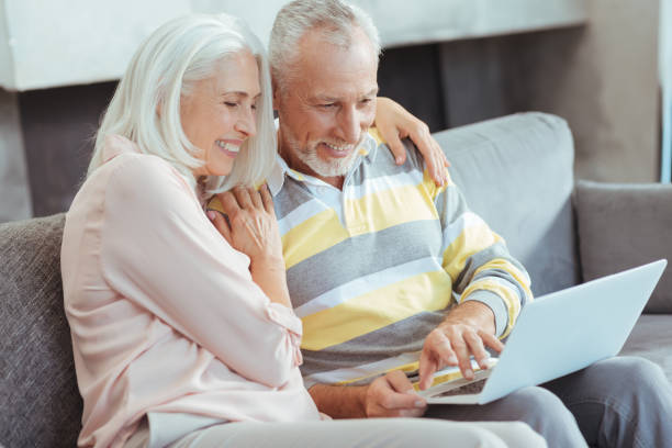 istock Loving aged couple sitting on the couch 849180950