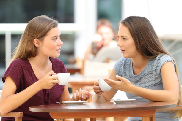 istock Serious friends talking in a restaurant 849181304