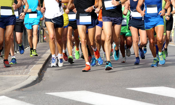 istock Men run the marathon on the road without logos and brand 849181598