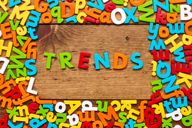 istock Overhead view of trends surrounded with colorful alphabets on wood 849187992