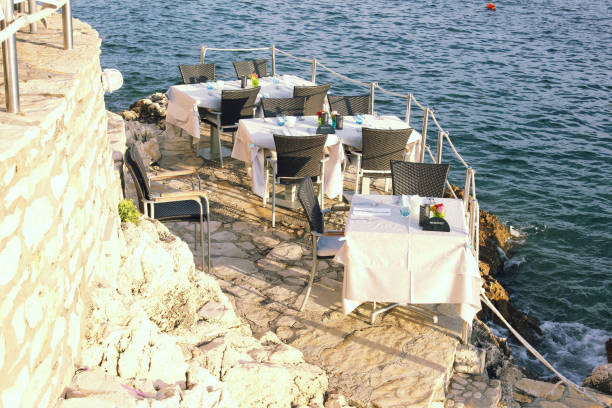 Three tables on the rocky shores of Adriatic sea.