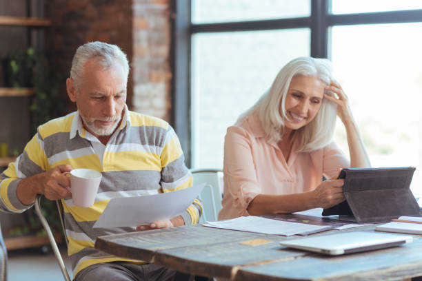 istock Positive aged couple sititng at the table at home 849191584