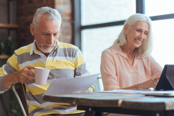 istock Positive aged man sitting at the table with his wife 849191672