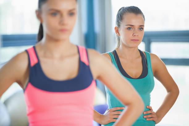 istock People standing with hands on hips at yoga class 849192582