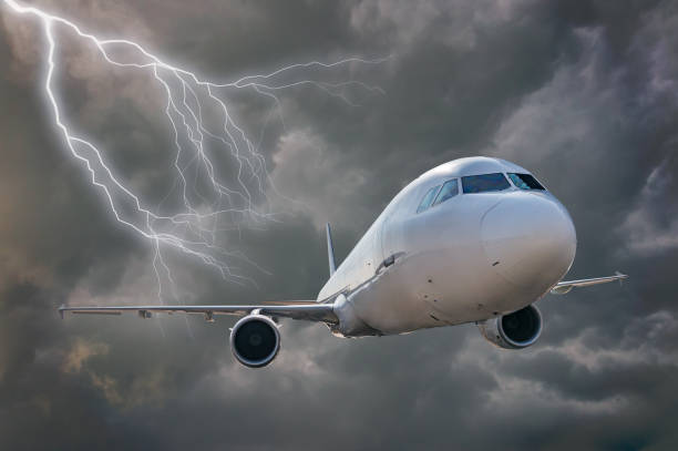 Airplane is flying in storm. Dark clouds and lightning in background. Airplane is flying in storm. Dark clouds and lightning in background. airplane crash photos stock pictures, royalty-free photos & images