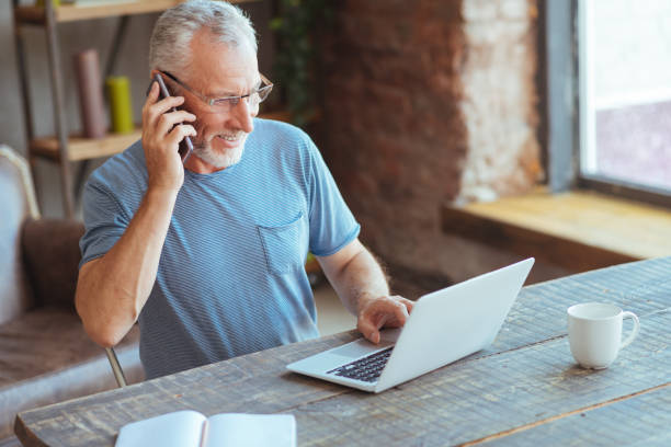 istock Joyful elderly man talking on phone 849197644