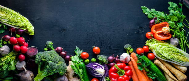 istock Big set organic food. Fresh raw vegetables. On a black chalkboard. 849203048