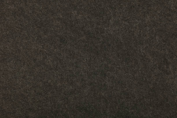 istock Grey or black felt background texture close up 849203118