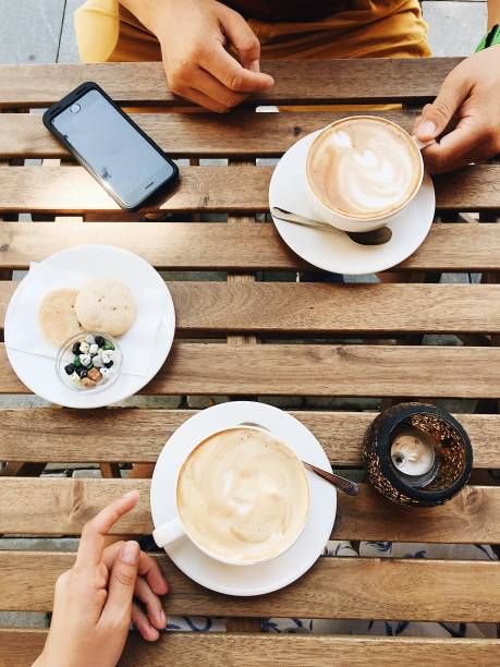 istock People drinking cappuccino in cafe 849203788
