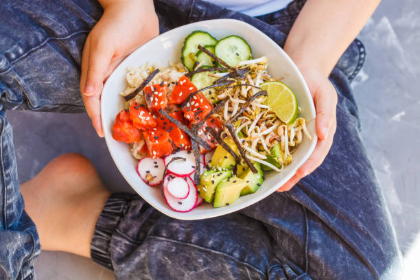 istock Hawaiian Ahi Poke dish with fish, rice and vegetables 849205268