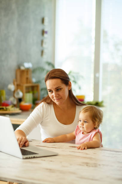 istock Mom sitting with a girl in a lap 849207418