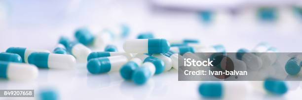 Tablets Scattered On The Table Of The Pharmaceutical Laboratory Stock Photo - Download Image Now