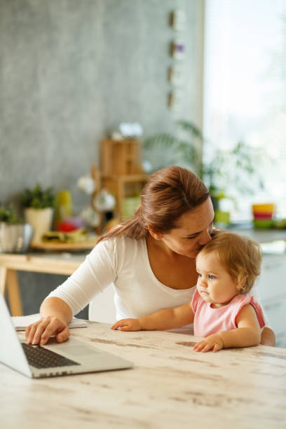 istock Mother kissing her baby 849208236