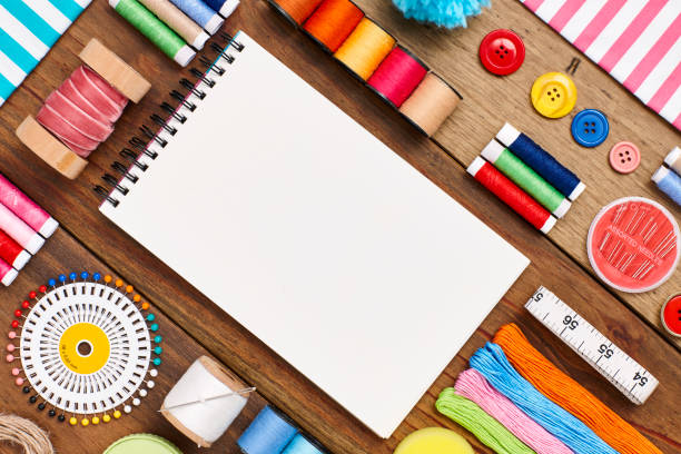 istock Overhead flat lay of spiral notebook with sewing items 849210784
