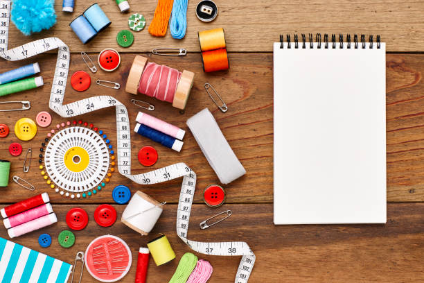 istock Overhead flat lay of spiral notebook and sewing products 849211198