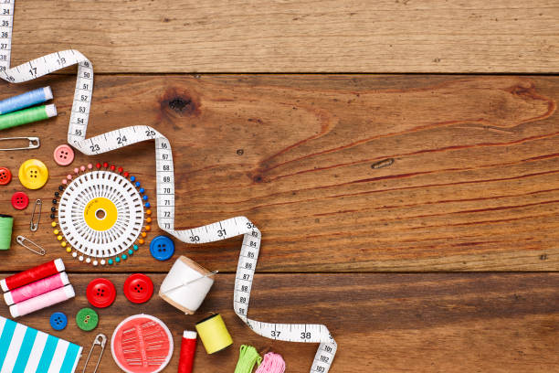 istock Overhead flat lay of sewing items in corner of table 849211884