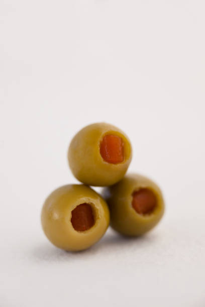 istock Close up of green olives arranged on table 849212068