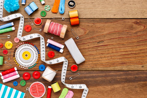 istock Overhead flat lay of sewing items on wooden table 849212142
