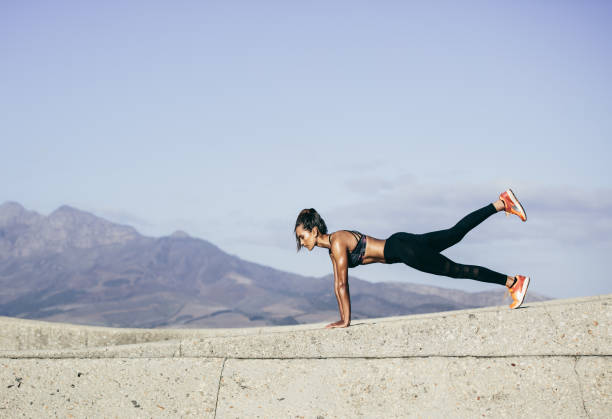 istock Muscular young woman doing push ups 849213122