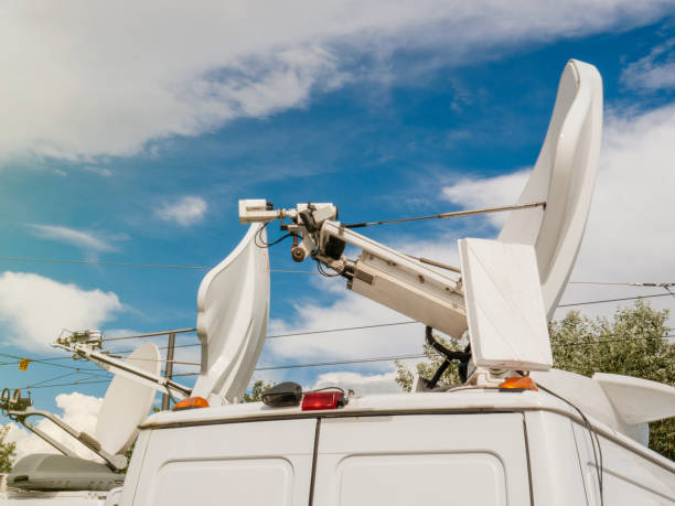 istock White satellite antennas against blue sky 849215490