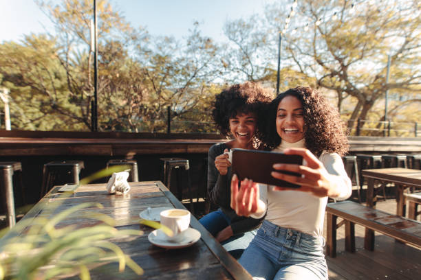 istock Two women having fun taking a selfie outdoors 849216306