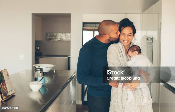 Lovely Young Family Of Three In Kitchen Stock Photo - Download Image Now - Newborn, Father, Baby - Human Age