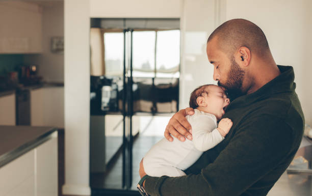istock Cute little boy in his father's arms 849220014