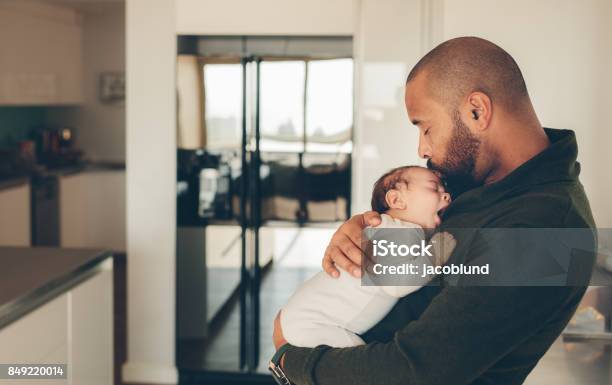Cute Little Boy In His Fathers Arms Stock Photo - Download Image Now - Father, Newborn, Baby - Human Age