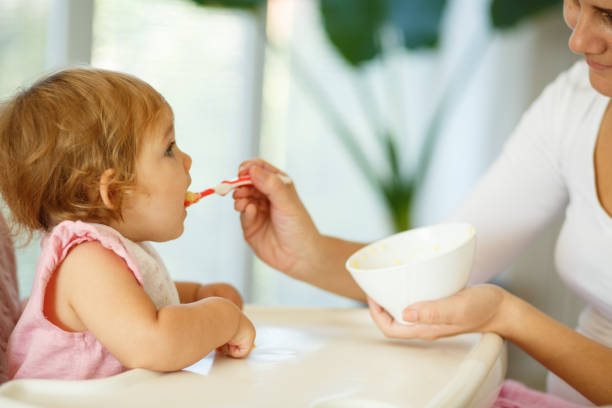 istock Mother feeding the baby 849221302