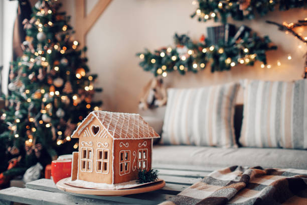 istock Homemade gingerbread house on light room background 849225802