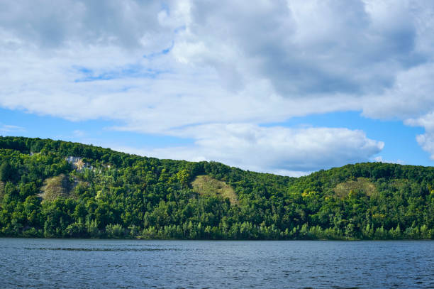 istock river landscape with hills and clouds during the day 849230272