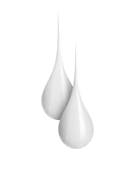 istock Two milk drops close-up isolated on white background 849230684
