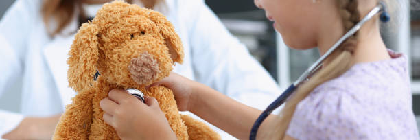 istock Little child with stethoscope at doctor reception 849233904